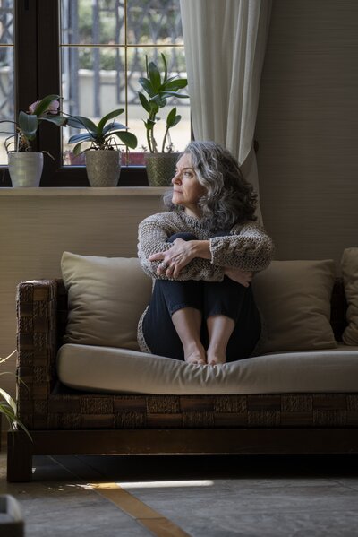 sad-elder-woman-sofa.jpg